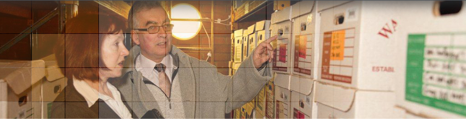 Small removal van leaving large estate home